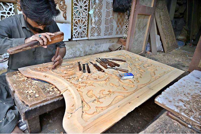 Carpenter Carves Intricate Wooden Designs