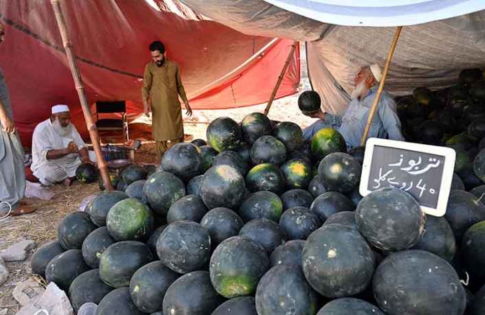 Vendors Sell Refreshing Watermelons to Attract Customers on Scorching Hot Day in City at Stadium Road