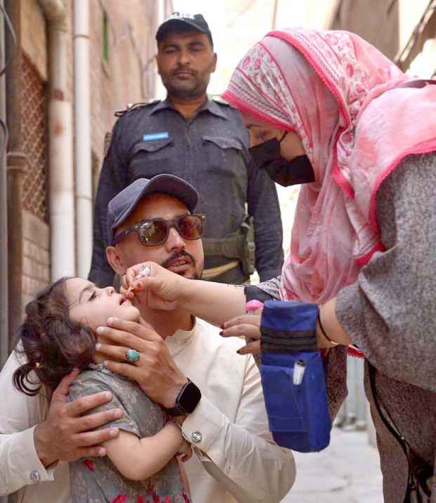 Health Worker Administers Polio Vaccine in Faqirabad