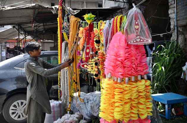 Vendor Displays Decorative Items for Sacrificial Animals Ahead of Eid al Azha in City Markets