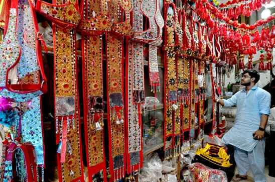 Vendor Prepares Decorative Accessories for Eid Al-Azha Sacrifices