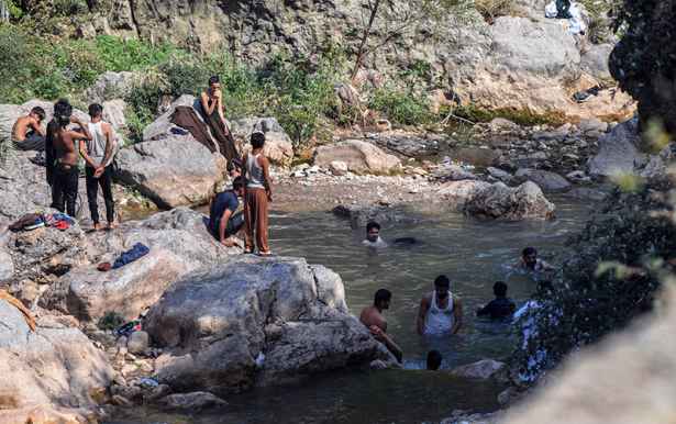 Youngsters Enjoy Bathing in Shahdara Valley Near Capital