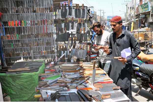 People Flock to Roadside Knife Stalls for Eidul Azha Sacrifice