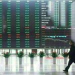 China shares dip marginally, Hong Kong rises as traders weigh tariff effects