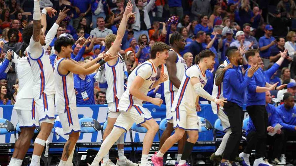 Florida Gators players celebrate a dominant win during their NCAA tournament title defense opener.
