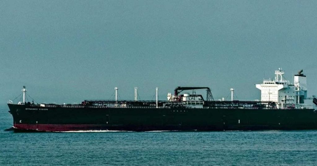 Commercial ships navigating under increased security measures in the Strait of Hormuz.