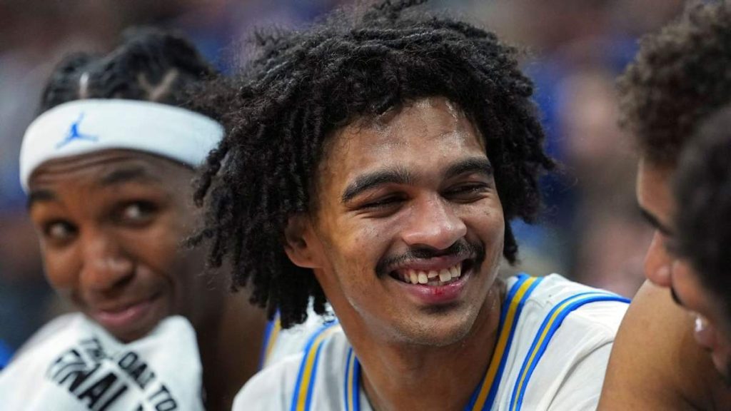 UCLA guard Skyy Clark smiles after losing a tooth during the NCAA tournament game against UCF.