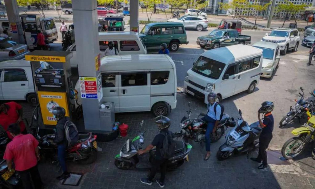 Sri Lankan currency displayed next to a fuel pump, symbolizing the country's fuel price hike amidst economic challenges.